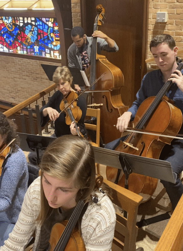 String musicians play violin, cello, and double bass during worship at St. Thomas Episcopal Church in Columbus, Georgia.