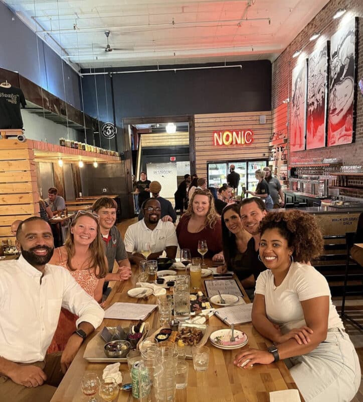 Members of the Young Adults Connecting Together (YACT) group share a meal during a social outing in Columbus, Georgia.